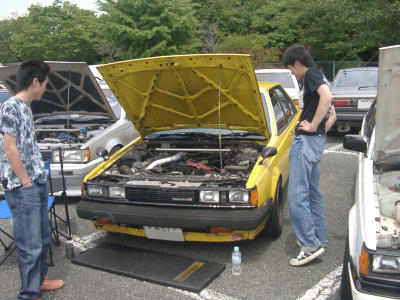 Yellow Carina TA63 sedan on second national Toyota Carina A60 & Corona T140 meeting on mount Fuji