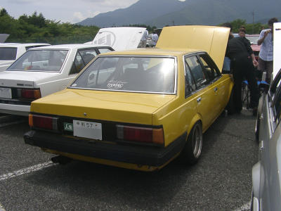 Yellow Carina TA63 sedan on second national Toyota Carina A60 & Corona T140 meeting on mount Fuji