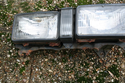 rusted frame on the Carina AA63 head lights