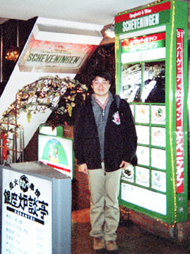 Japanese posing in front of Schevingen sign