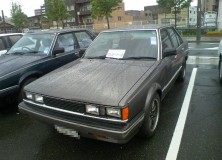 Dark grey Carina AA63 sedan