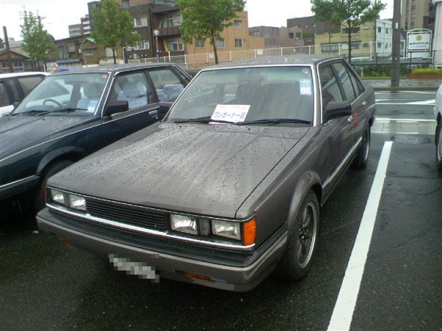 Dark grey Carina AA63 sedan