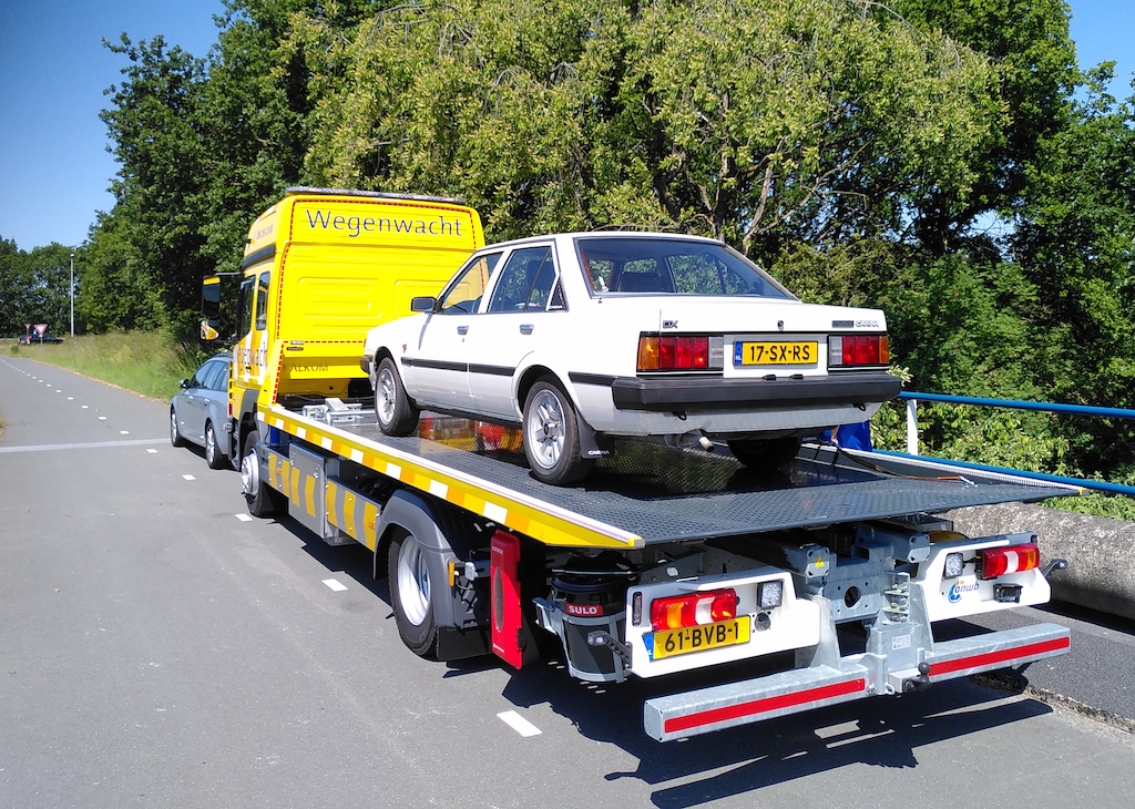 My Carina returns home on a flatbed truck