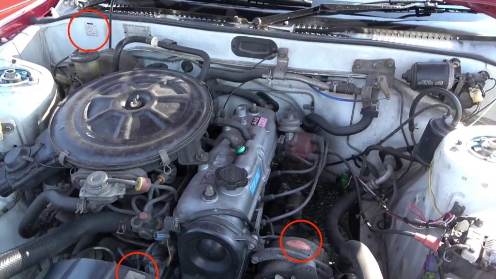 Toyota Carina SG Jeune engine bay with similar stickers