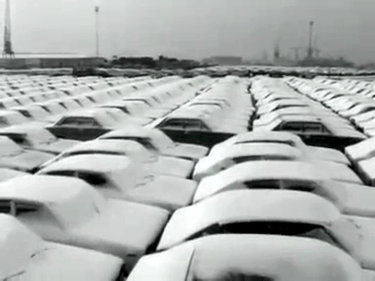 Many many many snowy Datsuns in the Rotterdam harbor