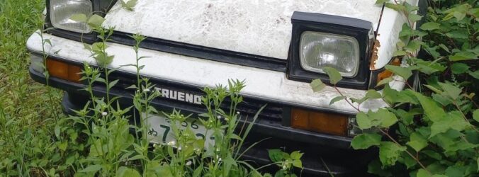 Abandoned rusty two-door Sprinter Trueno AE86