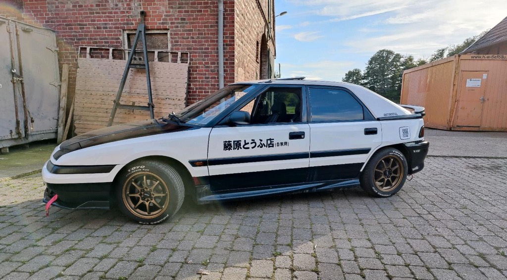 This Mazda 323F really wants to be a five door Fujiwara Tofu-ten