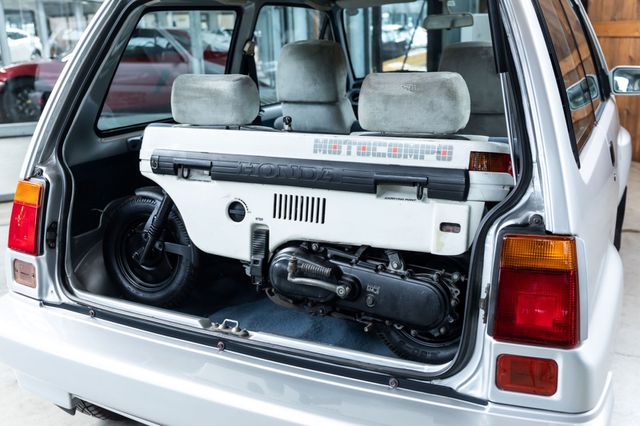 Honda City Turbo II with white Motocompo in the boot