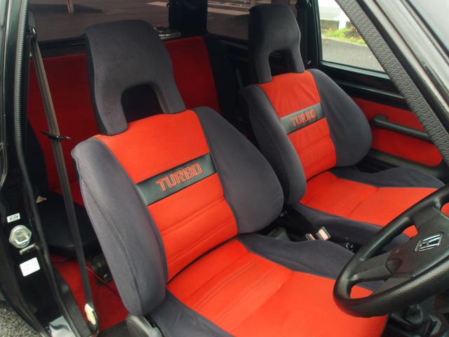 Black Honda City Turbo with red interior