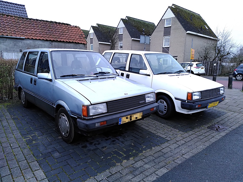 Blue 1985 Nissan Prairie features a bonnet badge